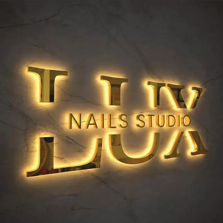 Illuminated gold letter sign